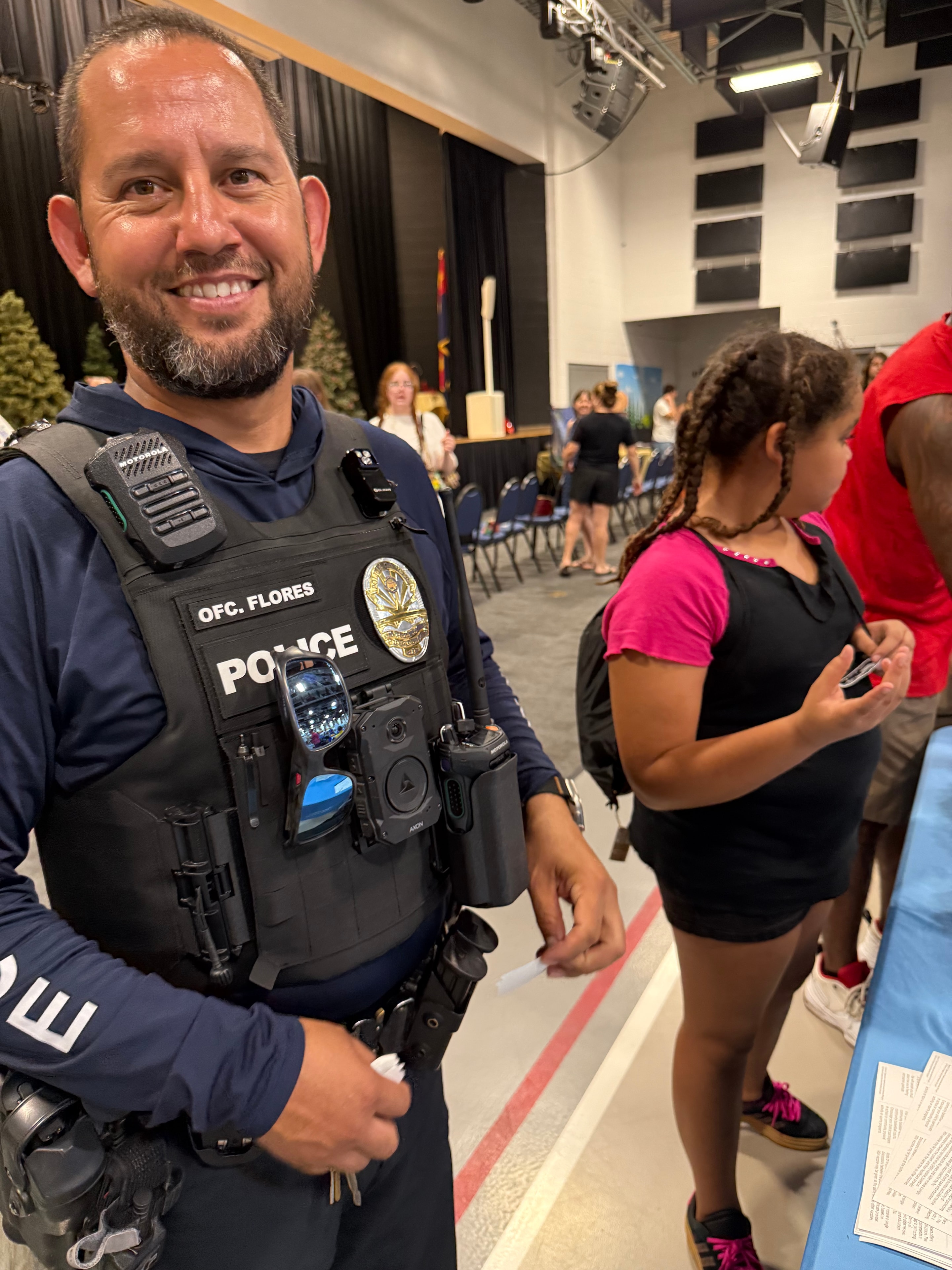 Officer Flores engaging with community at the fair